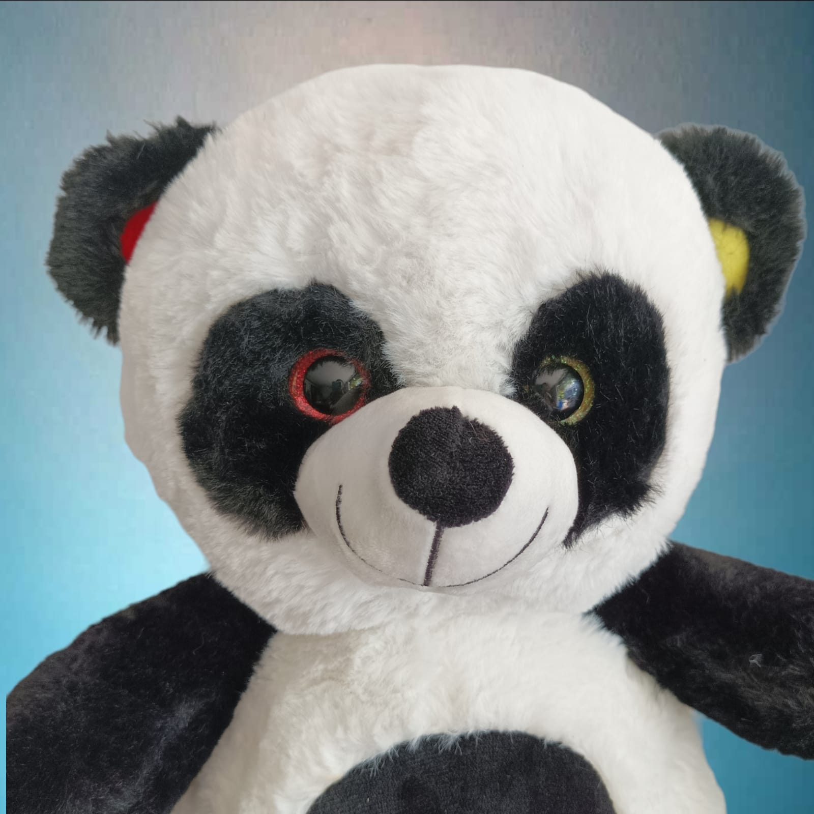 Kuscheltier Plüsch Pandabär sitzt 40 cm gelb und rot